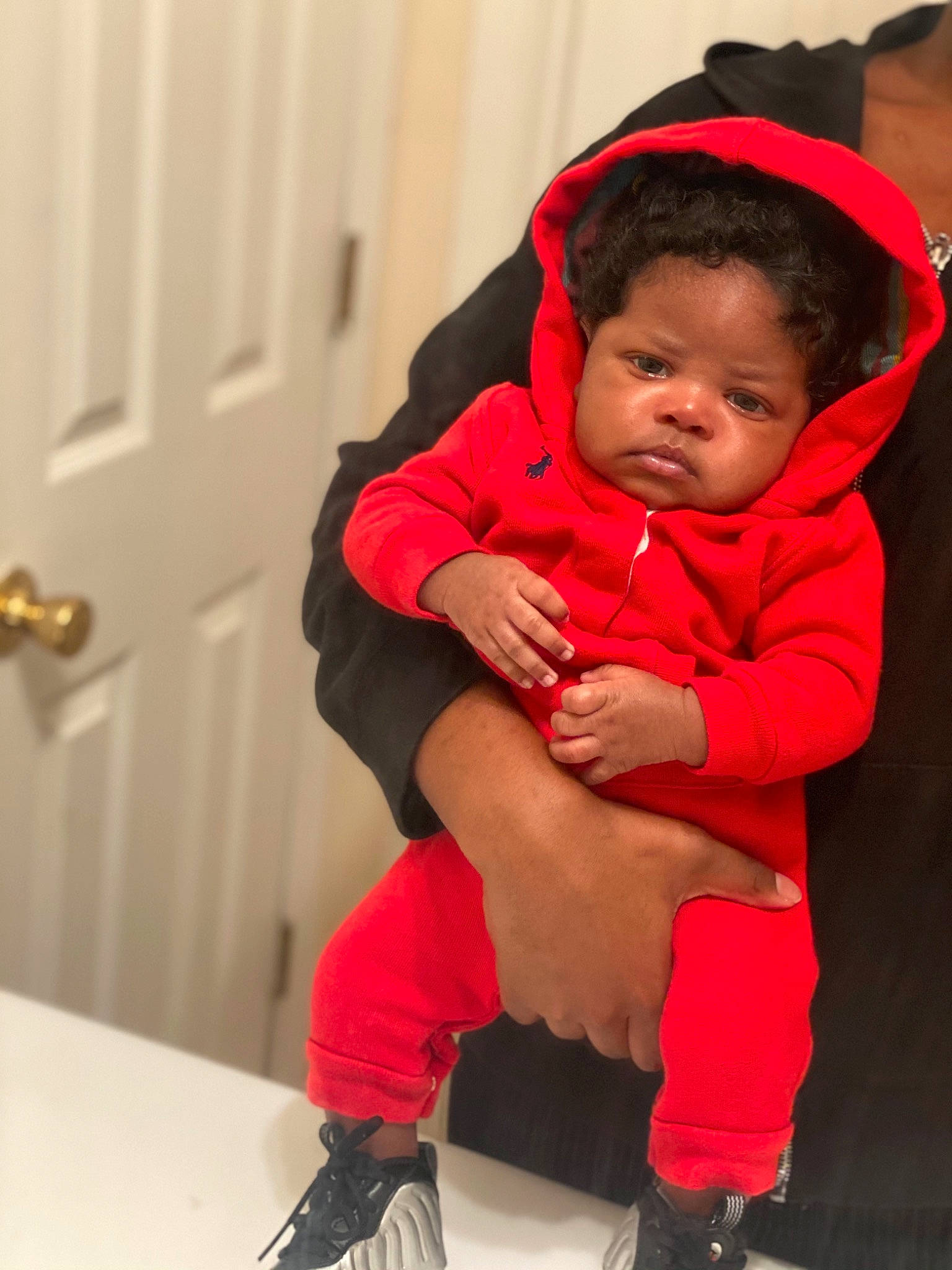 Kristian is registered to the contest to win money with this photo: baby, baby_toddler_clothing, event, flooring, fun, happy, human_body, human_leg, knee, lap, leg, magenta, person, skin, sleeve, smile, sneakers, sock, thigh, toddler