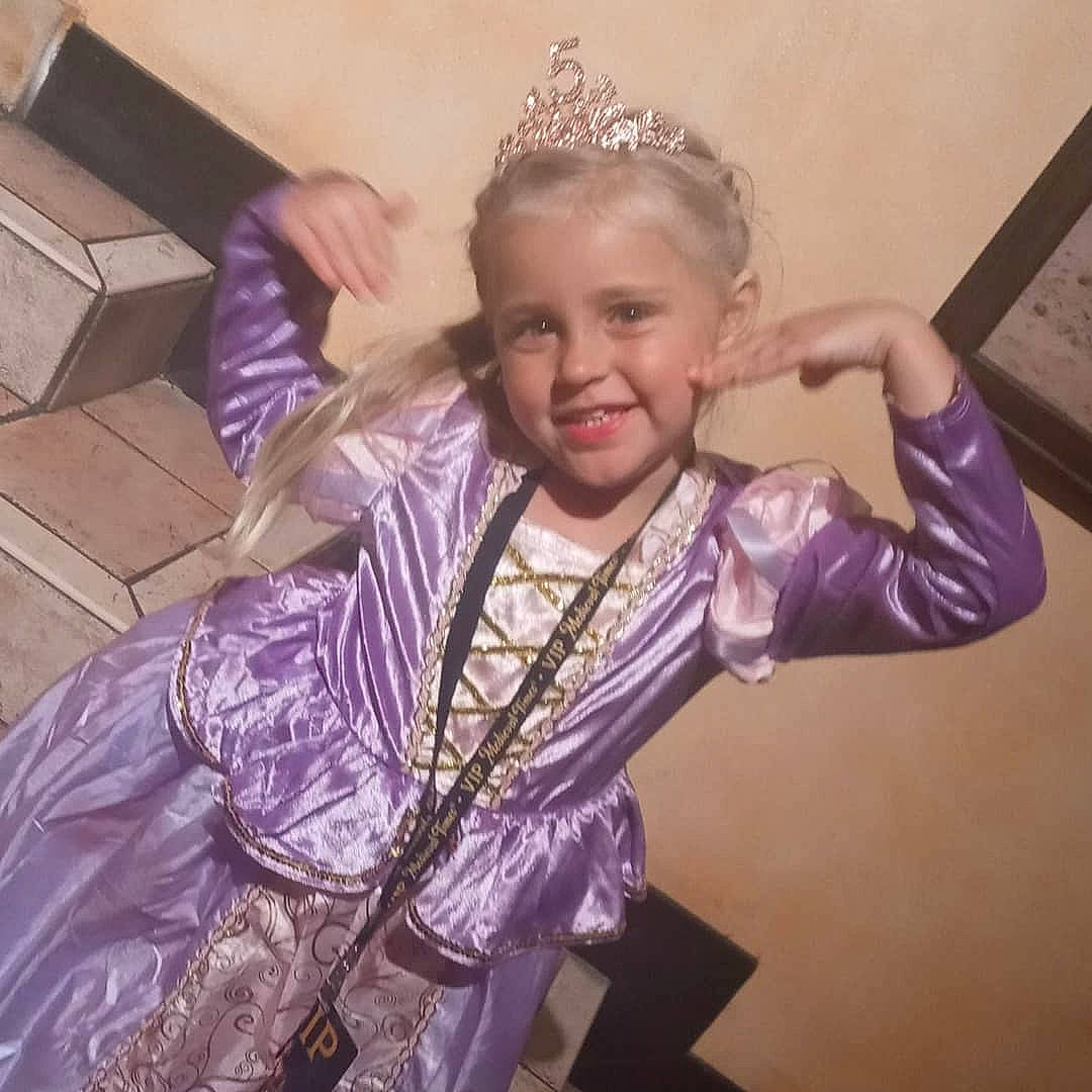 Joy is registered to the contest to win money with this photo: cool, entertainment, event, fashion_accessory, fashion_design, fun, gesture, happy, headband, headpiece, jewellery, joy, makeover, necklace, performing_arts, person, purple, shipping_box, sleeve, smile