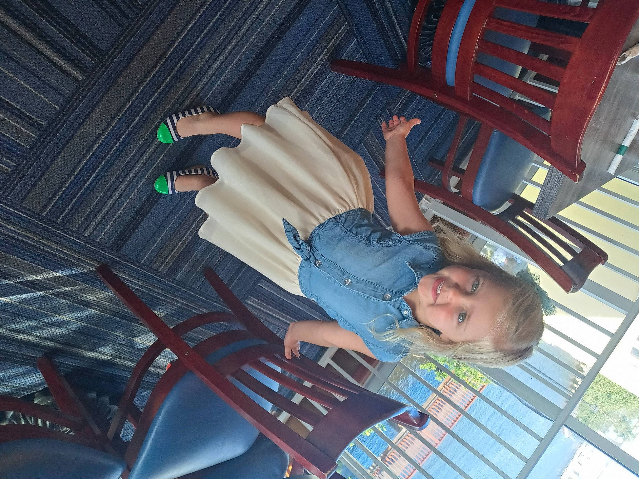 Joy is registered to the contest to win money with this photo: automotive_design, chair, comfort, dress, electric_blue, flash_photography, flooring, fun, gesture, hand, human_leg, joy, leisure, nail, pattern, person, room, sandal, sitting, smile