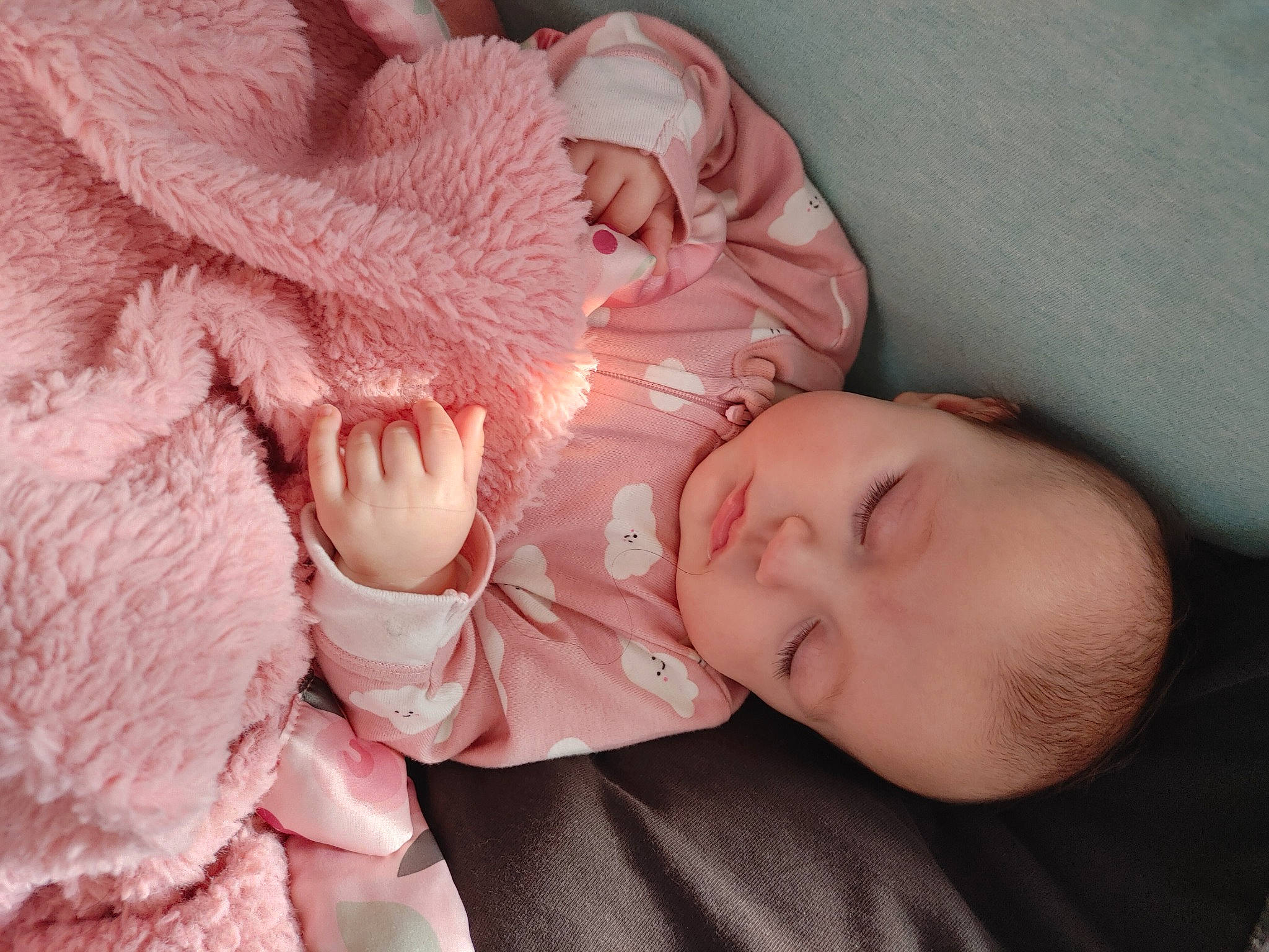 Sydney is registered to the contest to win money with this photo: baby, baby_sleeping, baby_toddler_clothing, cheek, child, close_up, comfort, finger, hand, human, iris, lip, mouth, nose, person, pink, product, skin, sleeve, textile