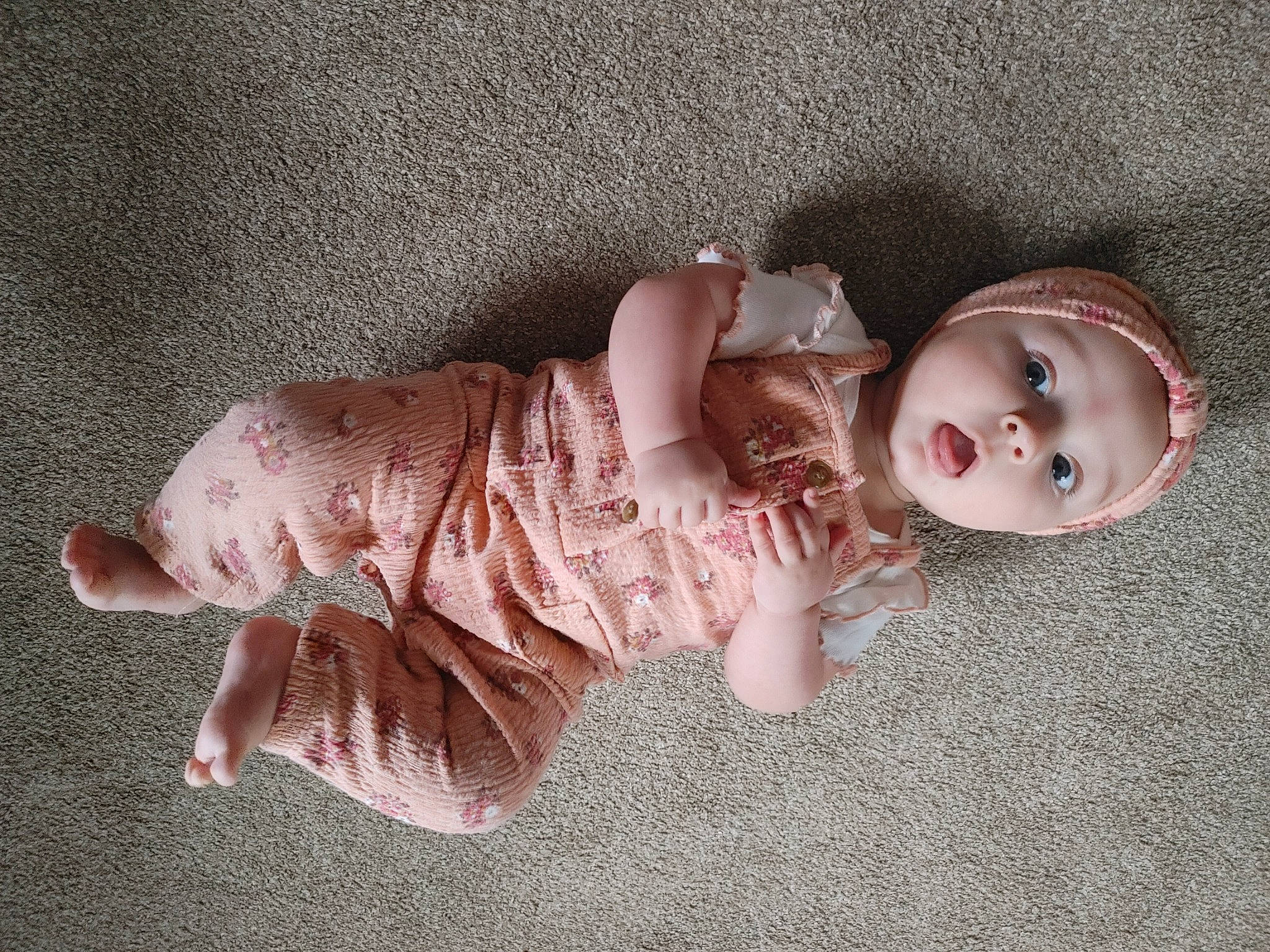 Sydney joined the competition — help win amazing prizes! baby, baby_products, baby_toddler_clothing, baby_toys, cheek, child, doll, dress, fashion_accessory, foot, pattern, peach, person, pink, sitting, skin, sleeve, toddler, toy, vintage_clothing