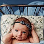 baby, infant, headband, flower, pillow, bed, blanket, blue, cute, portrait, skin, face, eyes, newborn, resting, indoors, sleepwear, child, young, cozy