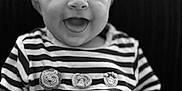 Harrison joined the competition — help win amazing prizes! baby, smiling, striped_clothing, infant, cute, face, portrait, happy, child, black_and_white, seated, hand, knit_patch, animal_patch, closeup, young_child, indoors, texture, soft, comfort