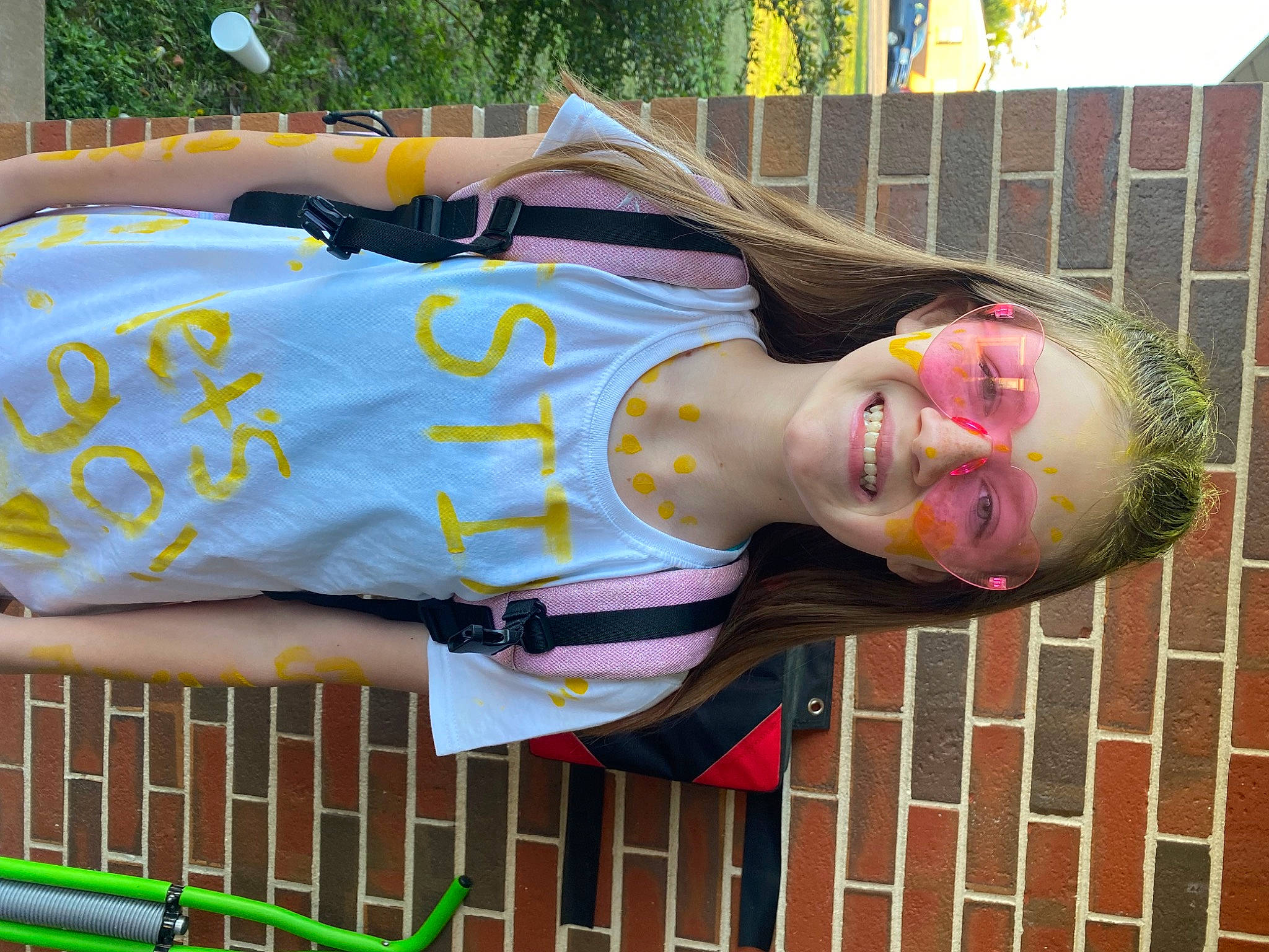 Summer is registered to the contest to win money with this photo: art, eyewear, fun, grass, joy, leisure, magenta, person, pink, sculpture, statue, textile, tree, visual_arts