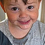 Malakai is registered to the contest to win money with this photo: child, boy, smile, face, brown_eyes, hair, gray_tshirt, messy, indoors, closeup, portrait, happy, young, casual_clothing, skin, expression, cute, person, childhood, front_view