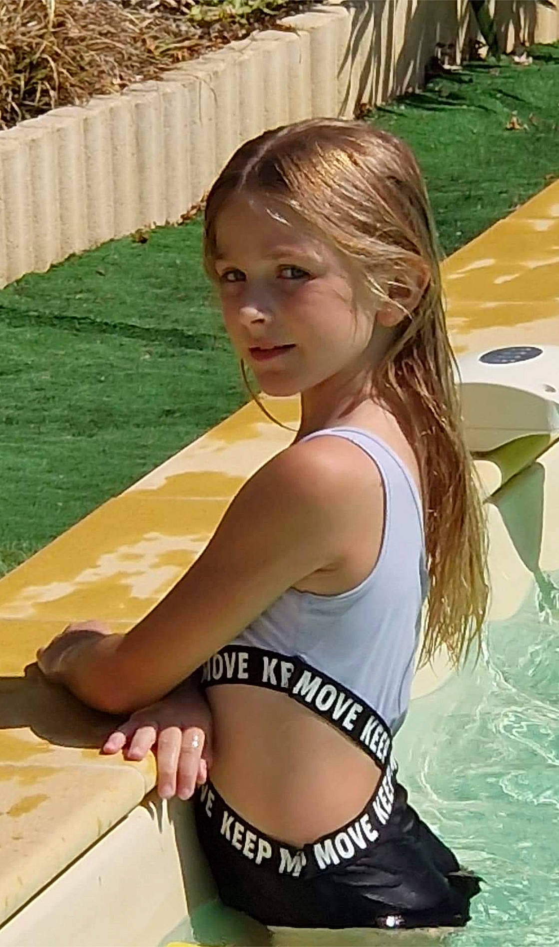 Marina participe au concours pour gagner de l'argent avec cette photo : beauty, brassiere, chest, fun, grass, hair, hairstyle, happy, leisure, long_hair, navel, people_in_nature, person, recreation, summer, swimsuit_top, swimwear, thigh, trunk, undergarment