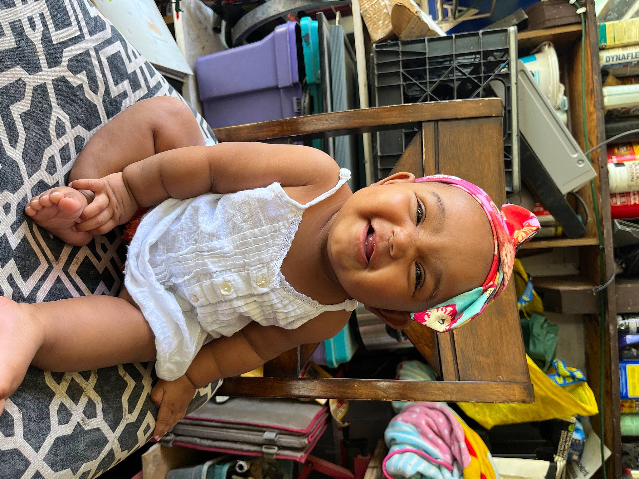 Aleina is registered to the contest to win money with this photo: abdomen, chair, chest, child, elbow, eyewear, fun, happy, human_leg, joy, knee, leg, leisure, person, plaid, room, shelf, shorts, smile, sunglasses