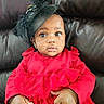 baby, child, red_dress, feathered_hat, black_hat, leather_couch, curious_look, wide_eyes, frilly_dress, indoor, portrait, cute, infant, sitting, clothing, hands, fists, headwear, fashion, person