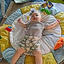 Hope joined the competition — help win amazing prizes! baby, infant, sleeping, play_mat, toy, soft_toy, blanket, headband, clothing, floor, indoor, child, peaceful, cute, legs, arms, face, comfort, rest, relaxation
