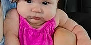 Hope joined the competition — help win amazing prizes! baby, child, infant, pink_clothing, headband, leopard_print, adult_hand, indoor, furniture, couch, portrait, cute, chubby, pout, holding, person, skin, face, expression, seated