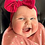 baby, smiling, face, headband, pink, bow, bib, polka_dot, cheeks, close_up, infant, happy, cute, child, portrait, clothing, skin, person, indoors, joy