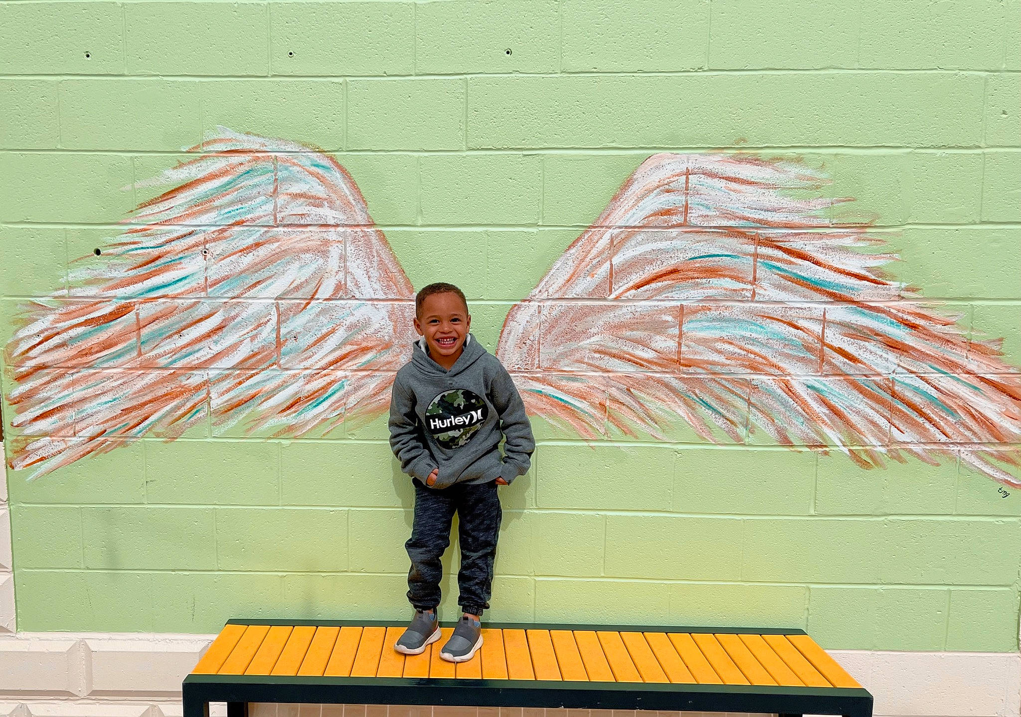 Ayden joined the competition — help win amazing prizes! art, artist, brick, facade, furniture, grass, green, illustration, joy, leisure, line, mural, net, pattern, person, recreation, rectangle, smile, t_shirt, table