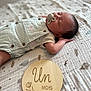 baby, sleeping, pacifier, overalls, blanket, plaque, wooden, pattern, infant, one_month, clothing, cute, peaceful, resting, portrait, child, young, bed, soft, indoor