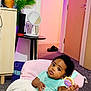 Angel joined the competition — help win amazing prizes! baby, child, indoor, toy, blanket, chair, cushion, carpet, mirror, plant, door, table, furniture, person, clothing, curious, seated, home, cozy, infant