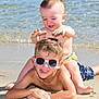 child, children, beach, sand, water, ocean, sunny, summer, play, fun, sunglasses, smile, happy, barefoot, swimwear, toddler, boy, outdoor, vacation, sunlight