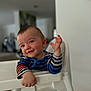 toddler, child, high_chair, striped_shirt, smiling, happy, indoor, face, person, baby, cute, leaning, furniture, home, portrait, young_child, colorful_clothing, seat, infant, expression
