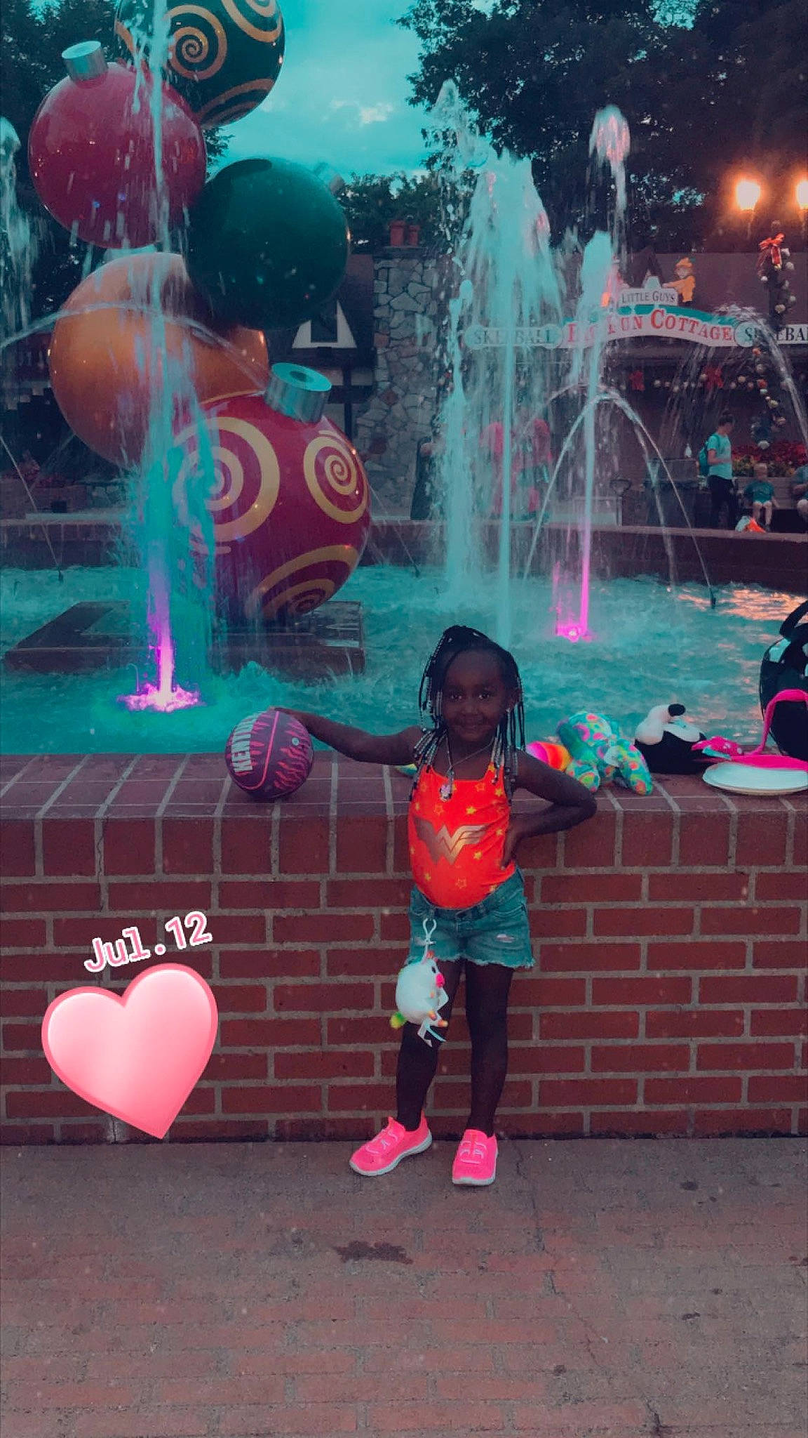 Zori is registered to the contest to win money with this photo: blue, cool, fountain, fun, green, happy, joy, leisure, magenta, organ, person, photograph, pink, public_space, recreation, red, toddler, tree, vertebrate, water