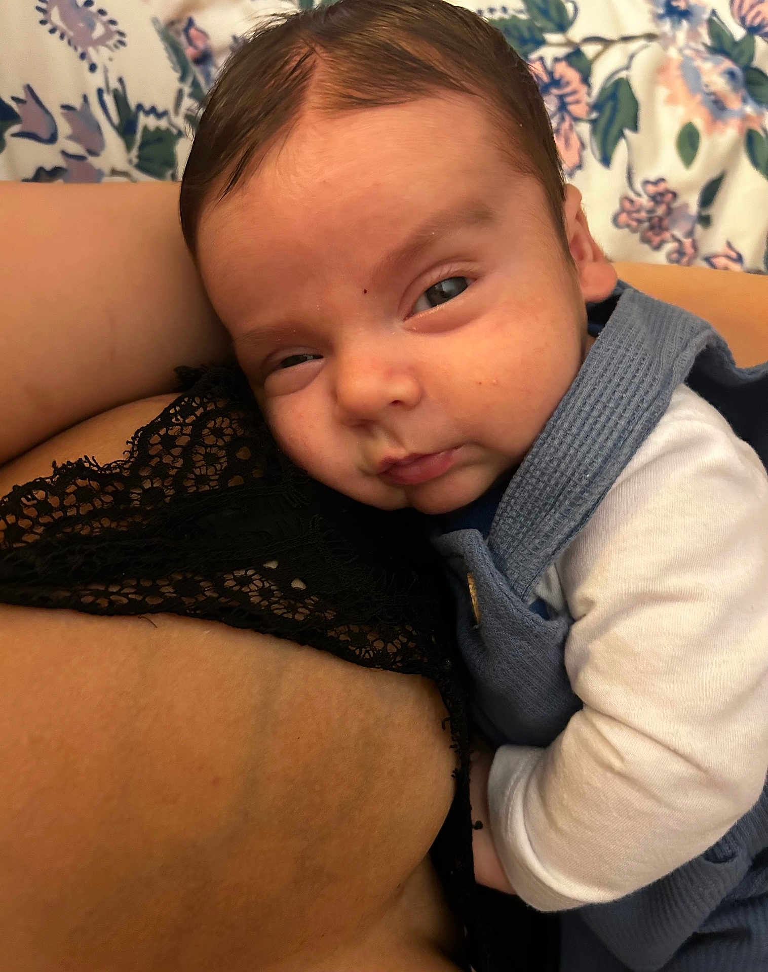 Enzo joined the competition — help win amazing prizes! baby, infant, child, sleepy, face, closeup, blue_clothing, lace, patterned_background, floral, skin, arm, person, resting, cute, indoors, portrait, baby_outfit, snuggle, cozy