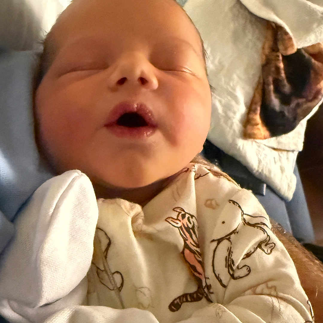 Jasper joined the competition — help win amazing prizes! newborn, baby, infant, sleeping, face, portrait, onesie, pajamas, tiger_pattern, blanket, swaddled, bed, indoors, cozy, cute, resting, closed_eyes, open_mouth, baby_clothing, photograph