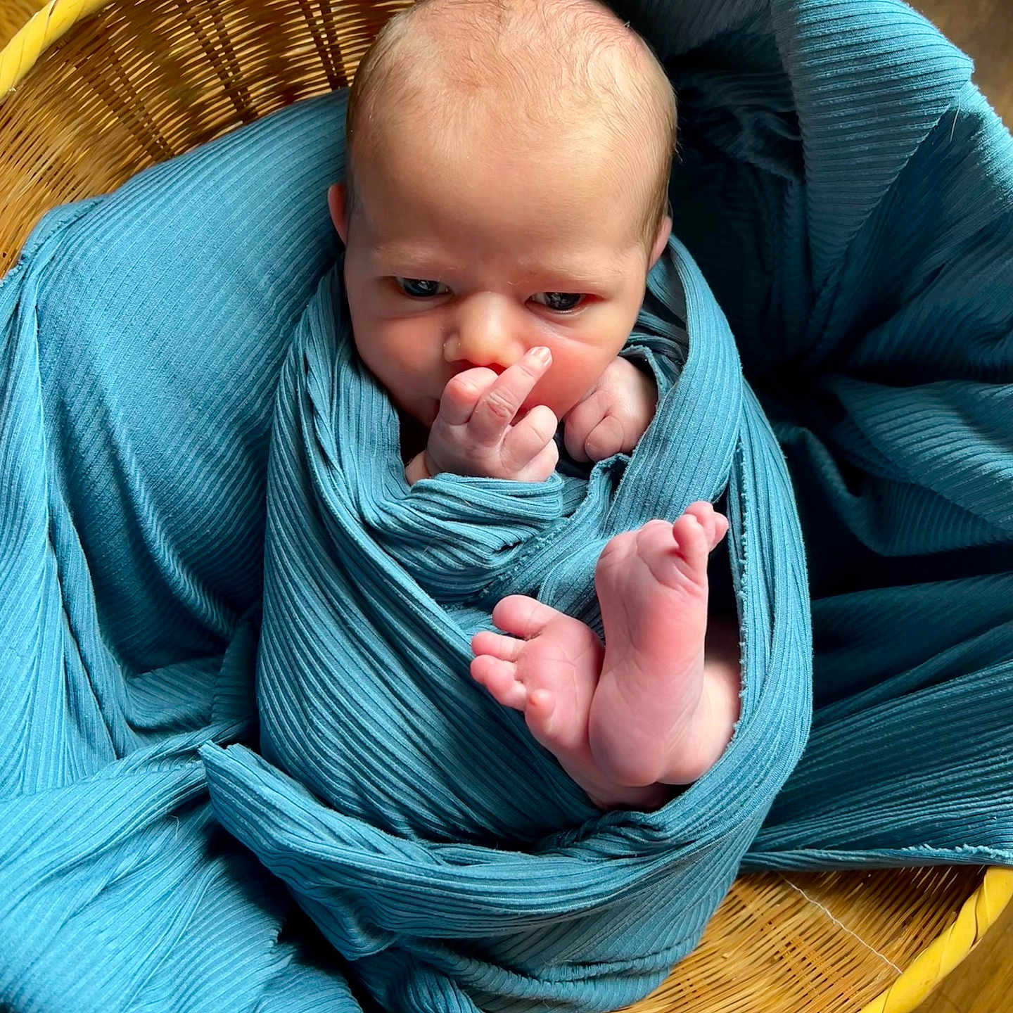Jasper joined the competition — help win amazing prizes! newborn, baby, infant, child, portrait, bundled, swaddled, blue_fabric, wicker_basket, basket, tiny_feet, bare_feet, hand, fingers, face, looking_at_camera, indoor, wooden_floor, cozy, photography