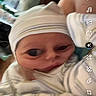 Jasper joined the competition — help win amazing prizes! baby, infant, child, face, portrait, selfie, filter, cartoon_effect, large_eyes, smiling, hat, winter_clothing, blanket, striped_clothing, indoor, social_media, screenshot, smartphone, cluttered_background, close_up