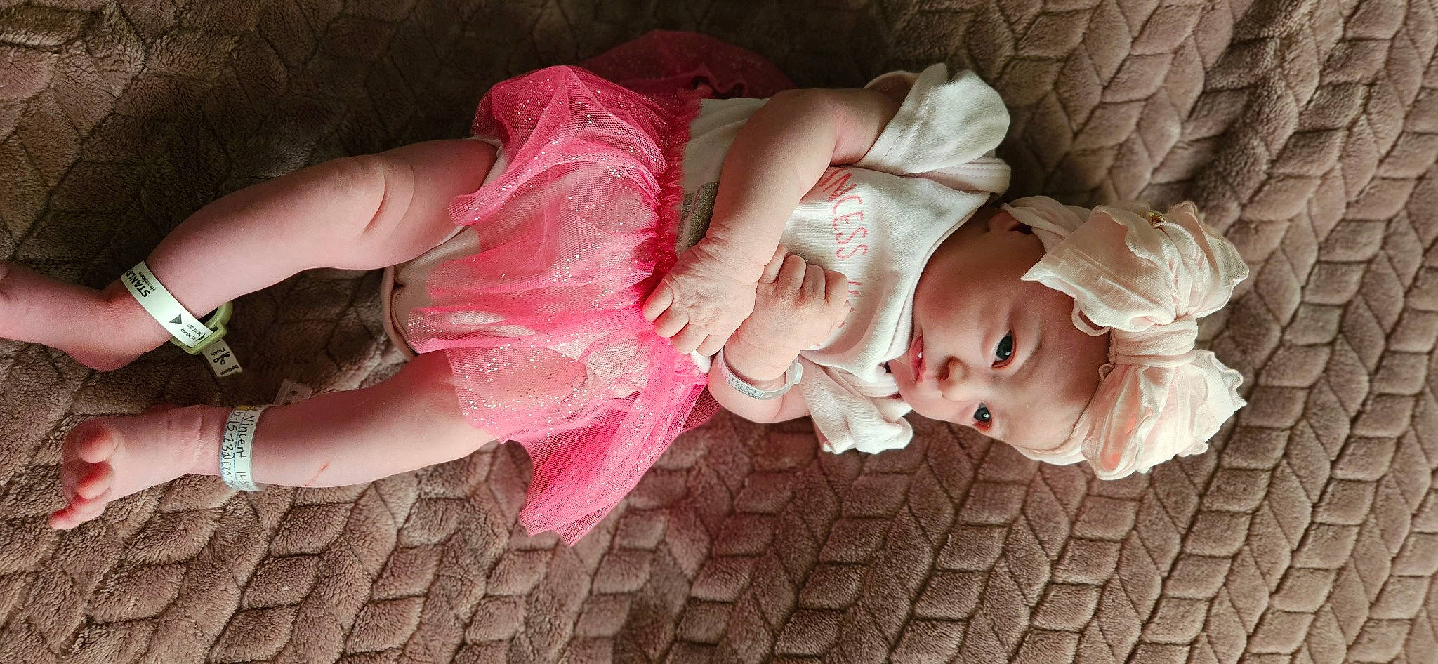 Nova joined the competition — help win amazing prizes! baby, baby_toddler_clothing, cheek, child, dress, embellishment, eye, fashion_accessory, finger, hair_accessory, hand, headpiece, human_body, lip, magenta, nail, person, petal, pink, skin