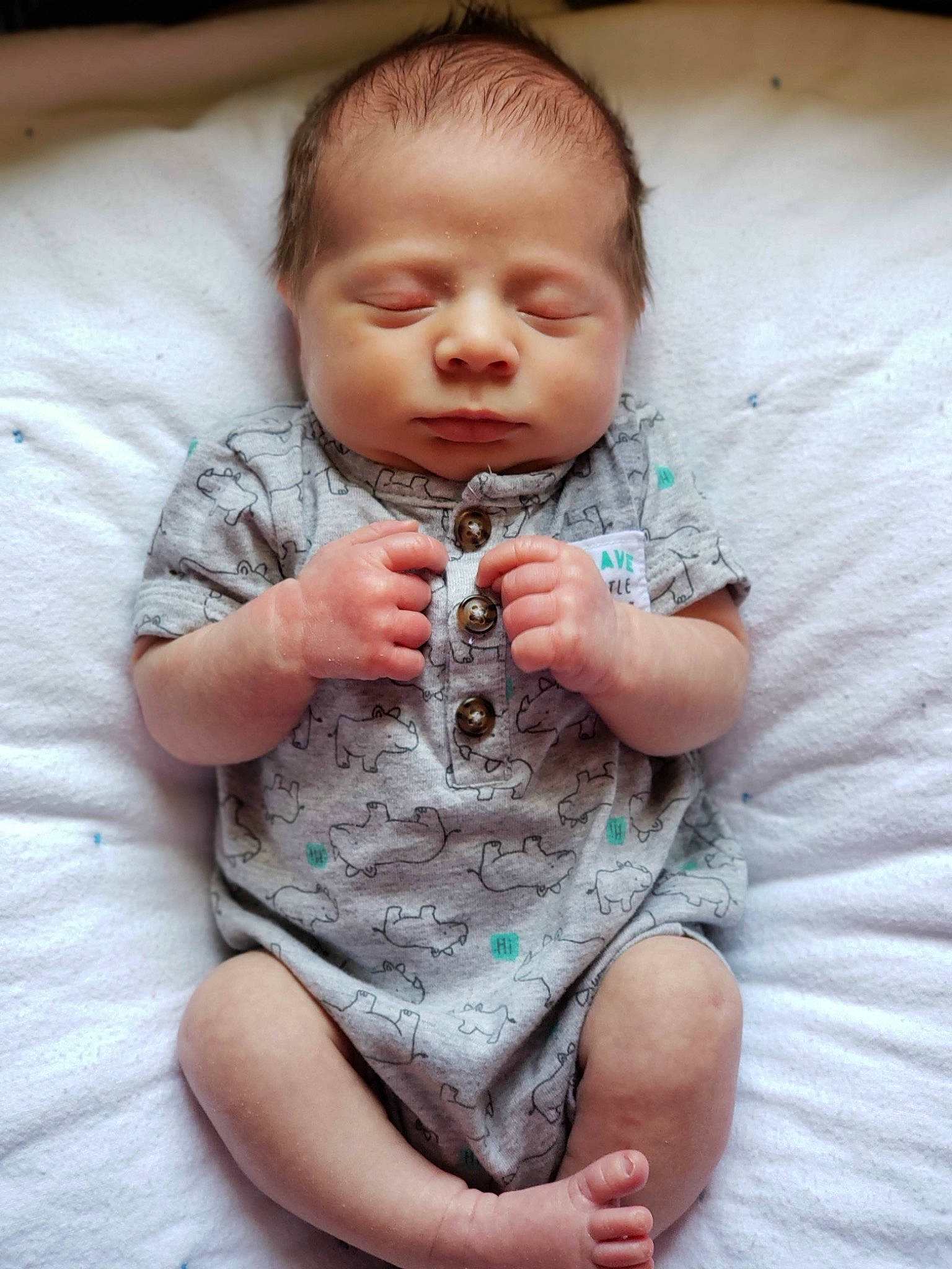 Maddux is registered to the contest to win money with this photo: baby, baby_toddler_clothing, cheek, chin, comfort, eye, face, finger, hairstyle, head, human_body, iris, lip, mouth, neck, nose, person, pink, skin, sleeve