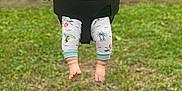 Nathaniel is registered to the contest to win money with this photo: baby, child, swing, playground, grass, outdoor, happy, smiling, onesie, feet, hands, park, joy, infant, seat, fun, summer, cute, person, play