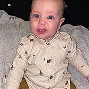 Nathaniel joined the competition — help win amazing prizes! baby, child, infant, face, blue_eyes, shirt, bear_print, pants, sitting, blanket, furniture, cushion, footwear, shoe, cute, portrait, indoor, young_child, expression, clothing