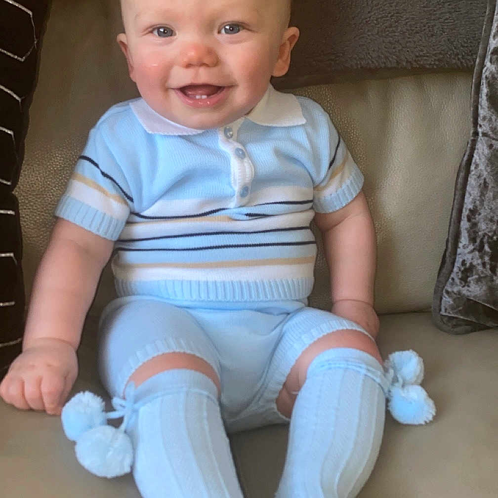 Elijah joined the competition — help win amazing prizes! baby, chair, clothing, couch, cushion, face, footwear, furniture, happy, head, homedecor, hosiery, pants, person, photography, portrait, shoe, shorts, sitting, sock