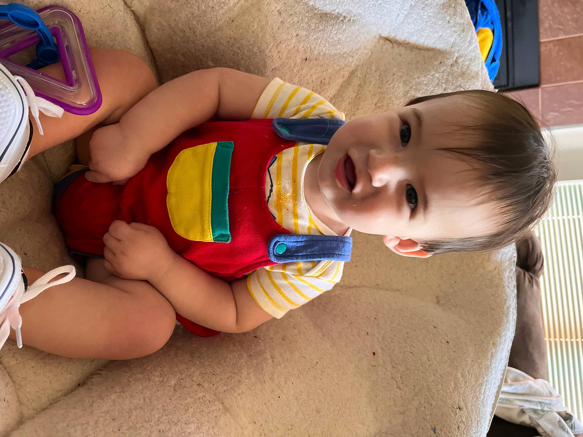 Landon is registered to the contest to win money with this photo: baby, baby_toddler_clothing, blue, cheek, eye, finger, hair, hand, happy, head, human_body, leg, mouth, neck, nose, person, skin, smile, textile, thigh