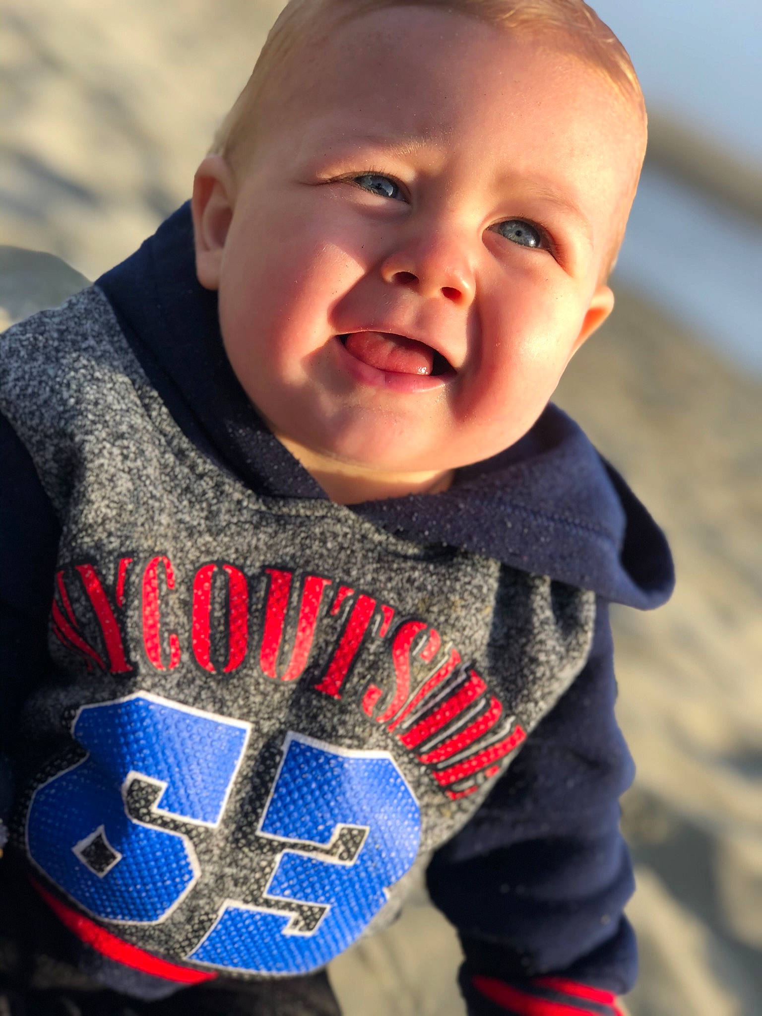 Dash joined the competition — help win amazing prizes! baby, blue, cheek, child, cool, design, face, facial_expression, happy, head, knitting, outerwear, people, person, photography, smile, sweater, textile, toddler, tooth