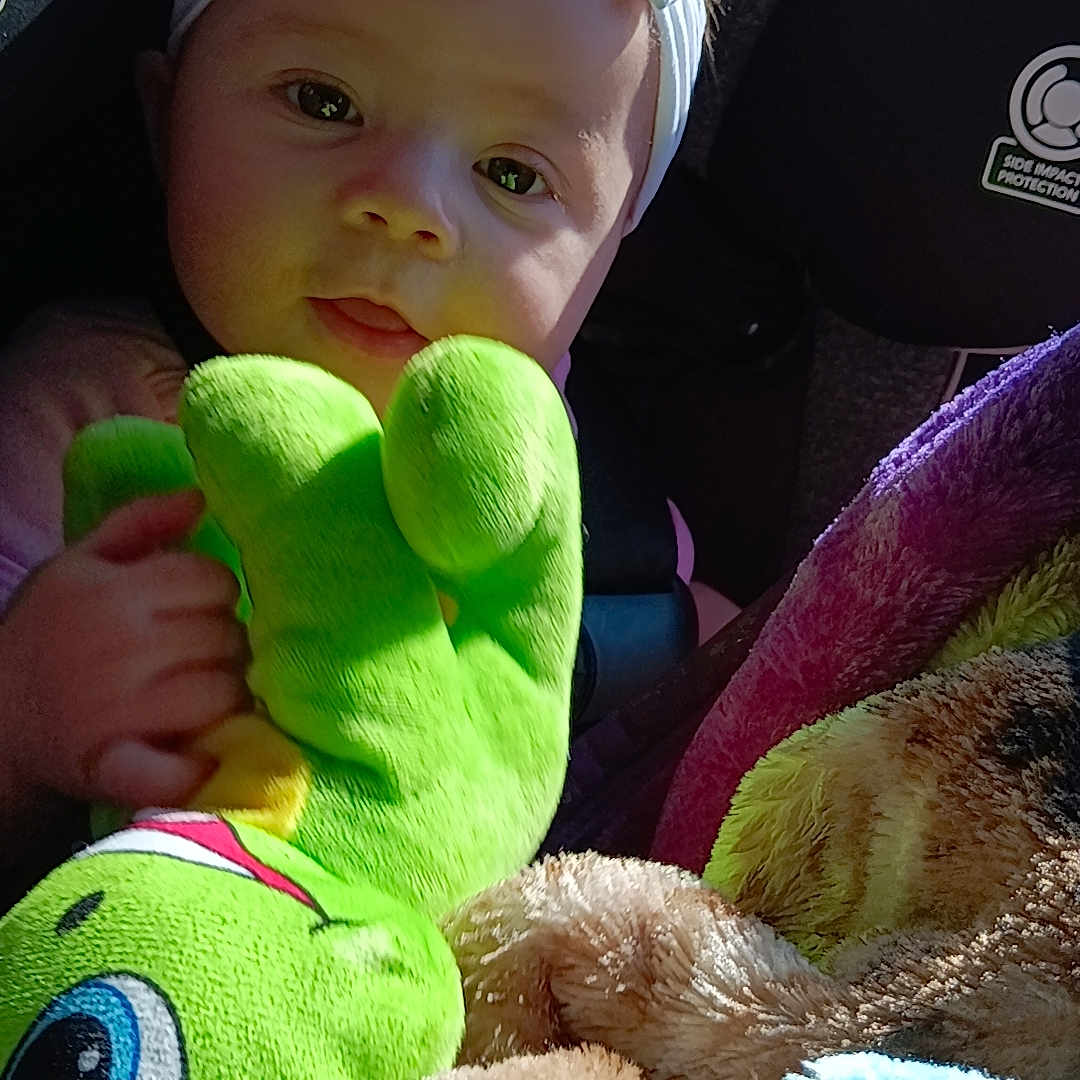 Sofia joined the competition — help win amazing prizes! baby, bodypart, bonnet, cap, car, car_interior, carseat, clothing, cushion, face, finger, hat, head, homedecor, person, plush, teddybear, toy, transportation, vehicle