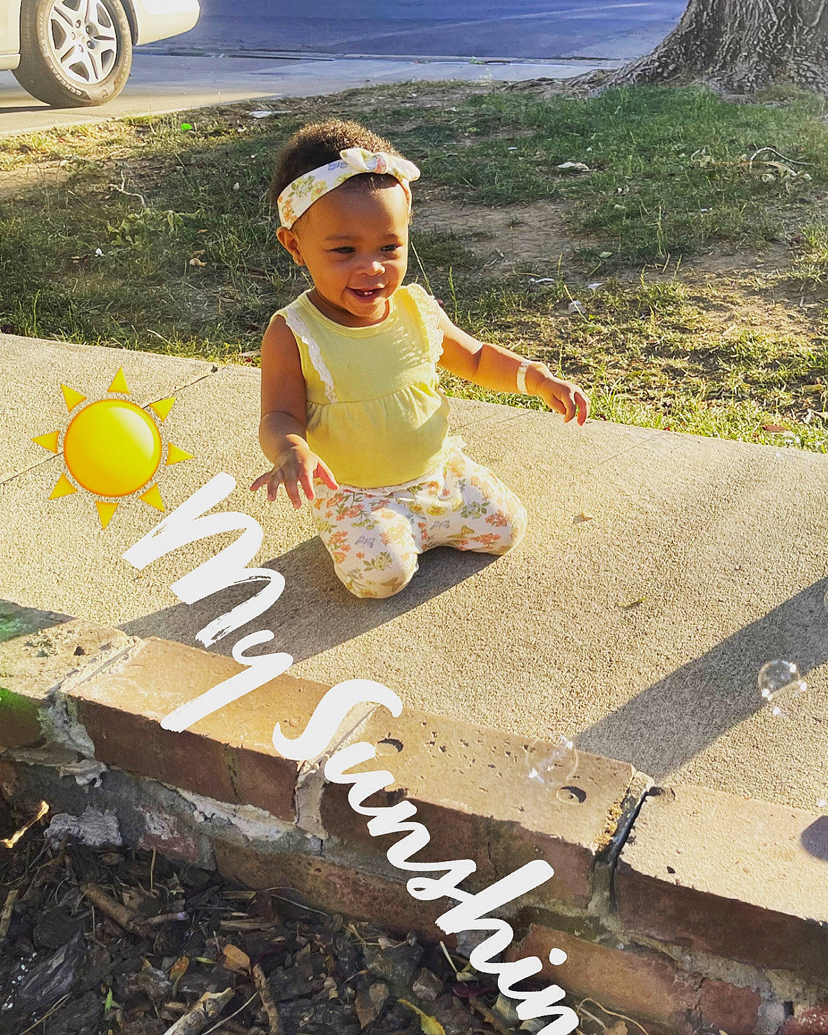 Xeidorn is registered to the contest to win money with this photo: balloon, child, fun, grass, green, happy, hat, joy, landscape, leisure, people_in_nature, person, plant, recreation, shorts, sitting, soil, tire, toddler, vehicle_registration_plate