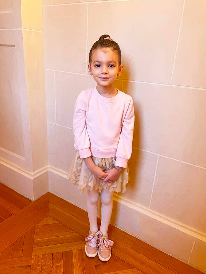 Sadie Snow joined the competition — help win amazing prizes! baby_toddler_clothing, dress, face, fashion_design, floor, flooring, hair, happy, hardwood, head, joy, knee, magenta, neck, person, pink, shoulder, sleeve, smile, thigh