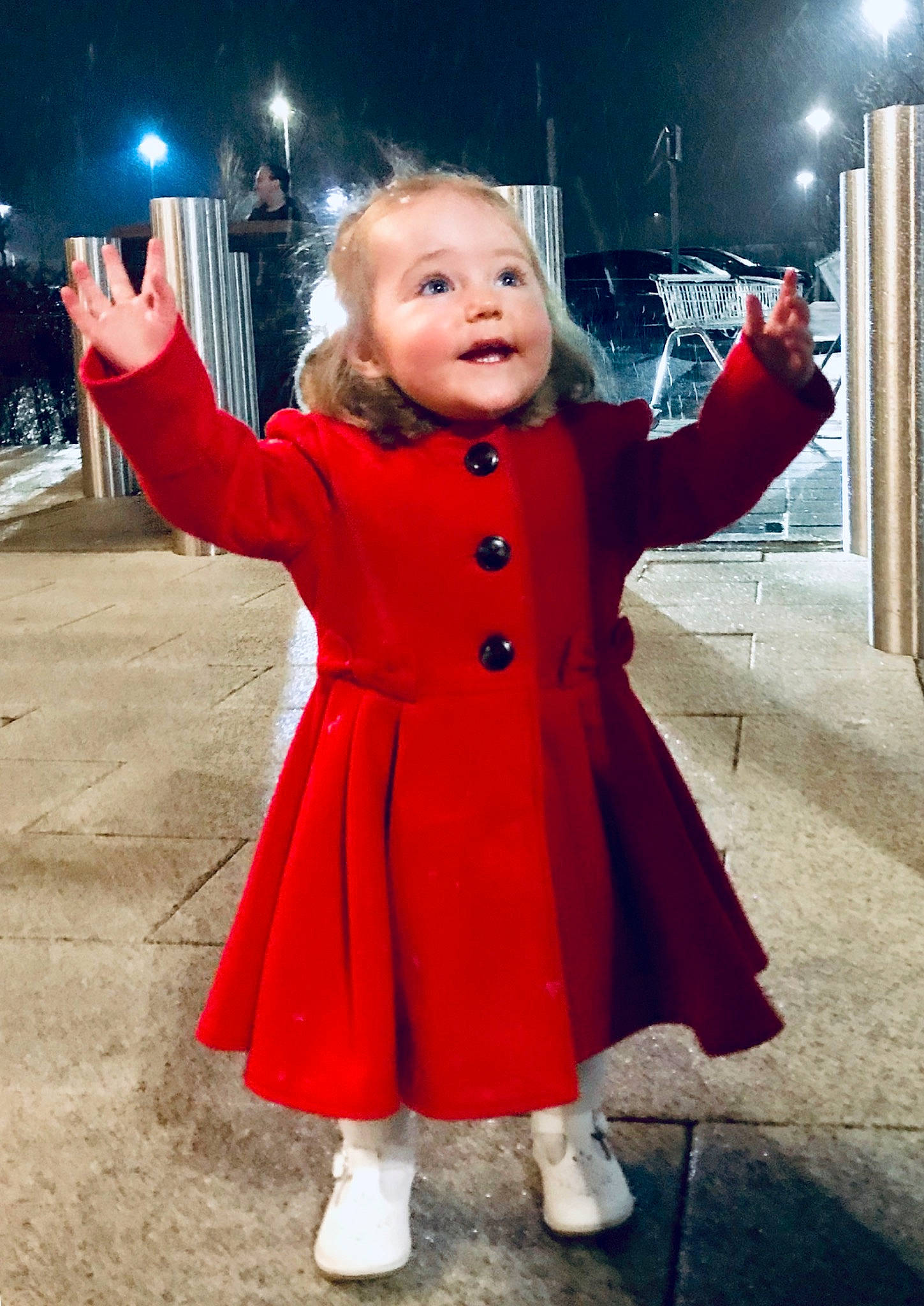 Caitlin is registered to the contest to win money with this photo: child, christmas_eve, clothing, coat, costume, fictional_character, outerwear, overcoat, person, smile, standing, toddler, trench_coat