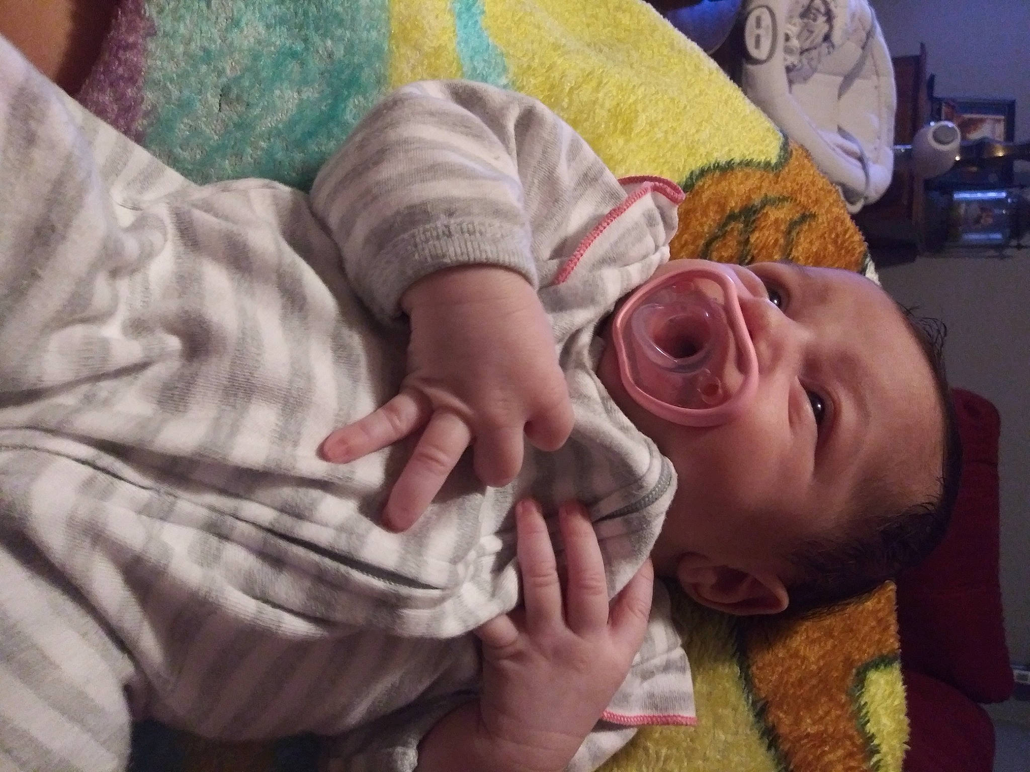 Daniela is registered to the contest to win money with this photo: baby, baby_products, baby_toddler_clothing, bed_sheet, bedding, bedtime, blanket, comfort, finger, gesture, linens, nail, person, plush, skin, stuffed_toy, thumb