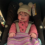 Isabelle is registered to the contest to win money with this photo: baby, blade, blanket, cap, clothing, coat, cushion, dagger, face, hat, head, homedecor, jacket, knife, knitwear, person, photography, portrait, sweater, weapon