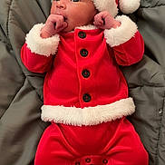 Remington joined the competition — help win amazing prizes! baby, infant, child, santa_outfit, red_clothing, white_fur_trim, hat, blanket, lying_down, cute, holiday, christmas, festive, portrait, face, hands, buttoned_jacket, footed_pants, indoors, cozy
