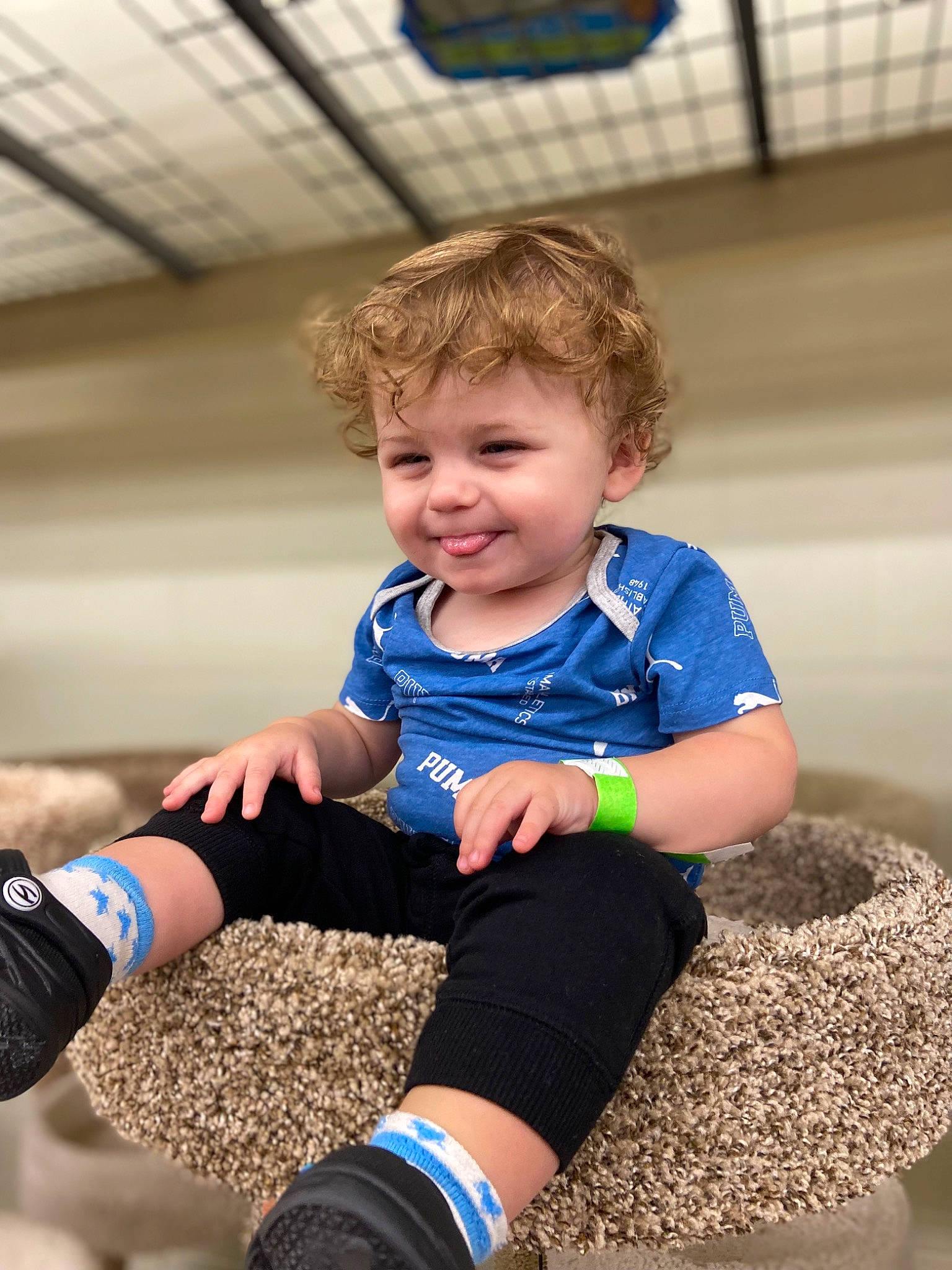 Logan is registered to the contest to win money with this photo: arm, baby_toddler_clothing, child, electric_blue, fun, grass, happy, human_leg, joy, knee, leisure, people, people_in_nature, person, recreation, sleeve, smile, sock, sportswear, standing
