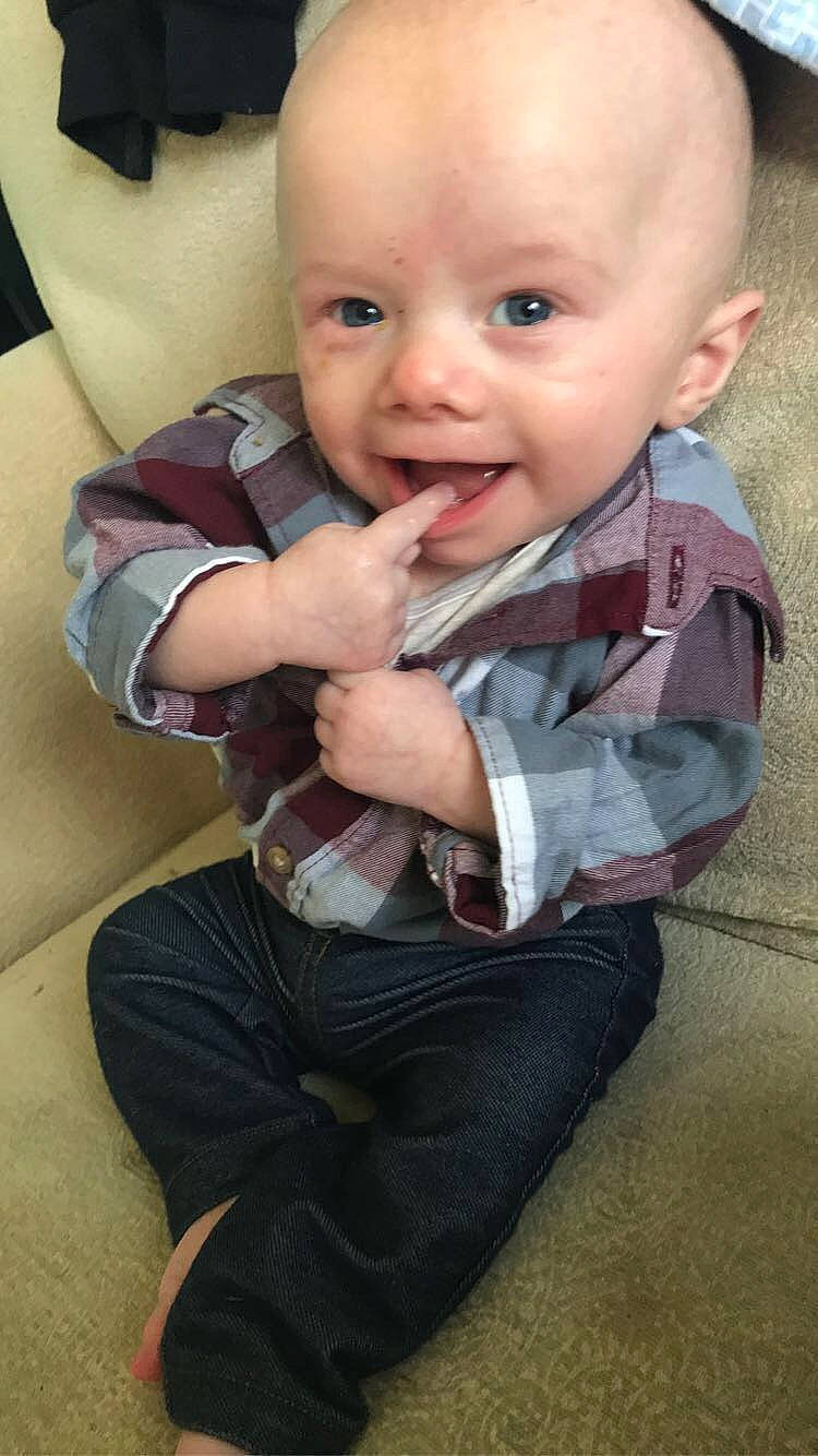 Jaxsyn joined the competition — help win amazing prizes! baby_toddler_clothing, cheek, chin, comfort, eye, face, finger, gesture, happy, head, iris, leg, lip, mouth, nose, person, skin, sleeve, smile, thumb