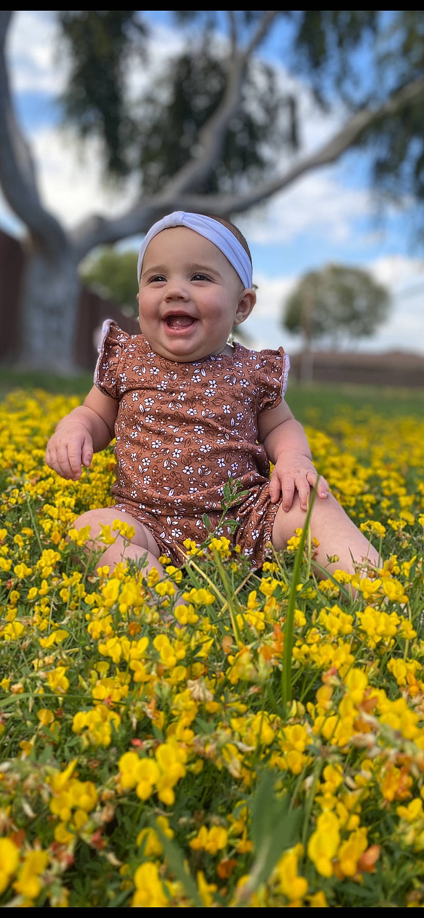 Sophie joined the competition — help win amazing prizes! baby, baby_toddler_clothing, child, dress, flower, grass, groundcover, happy, headwear, joy, leaf, leisure, meadow, people_in_nature, person, petal, plant, sky, smile, t_shirt