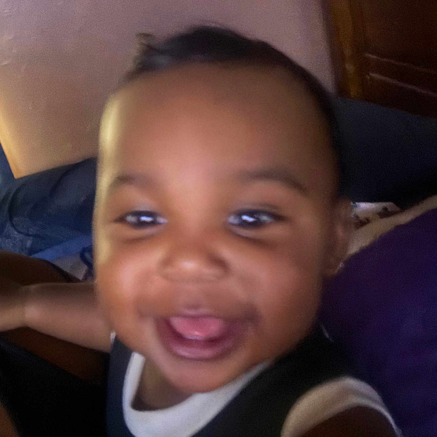 Nakahli joined the competition — help win amazing prizes! baby, black_hair, child, closeup, clothing, couch, cute, expression, face, furniture, happy, home, indoor, person, pillow, playful, portrait, smiling, toddler, young_child