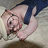 Hayden participe au concours pour gagner de l'argent avec cette photo : baby, infant, glasses, cap, denim_overall, blanket, soft_texture, cute, curious, lying_down, child, portrait, playful, skin, headwear, clothing, indoors, one_person, face, young_child