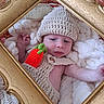 Hayden participe au concours pour gagner de l'argent avec cette photo : baby, knitted_hat, knitted_outfit, carrot_toy, blanket, golden_frame, soft_texture, infant, cute, portrait, cozy, hand, face, sleepwear, warm, newborn, resting, indoors, decor, child