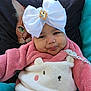Sakinah a rejoint le concours — aidez-le/la à gagner de superbes lots ! baby, child, white_bow, pink_jacket, cozy_clothing, cute_outfit, animal_face, cat_pillow, green_eyes, cushion, portrait, indoor, smiling, face, headwear, adorable, infant, cute, comfort, closeup