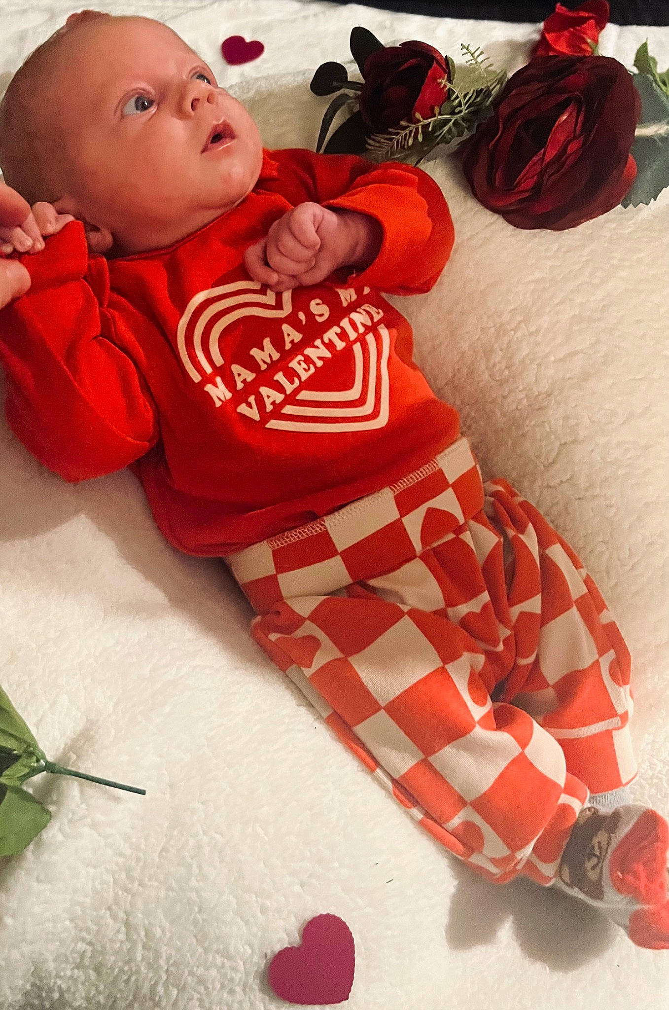 Noah is registered to the contest to win money with this photo: baby, baby_products, baby_sleeping, baby_toddler_clothing, child, comfort, happy, linens, orange, pattern, person, pink, red, sleeve, stuffed_toy, t_shirt, textile, thigh, toddler, toy
