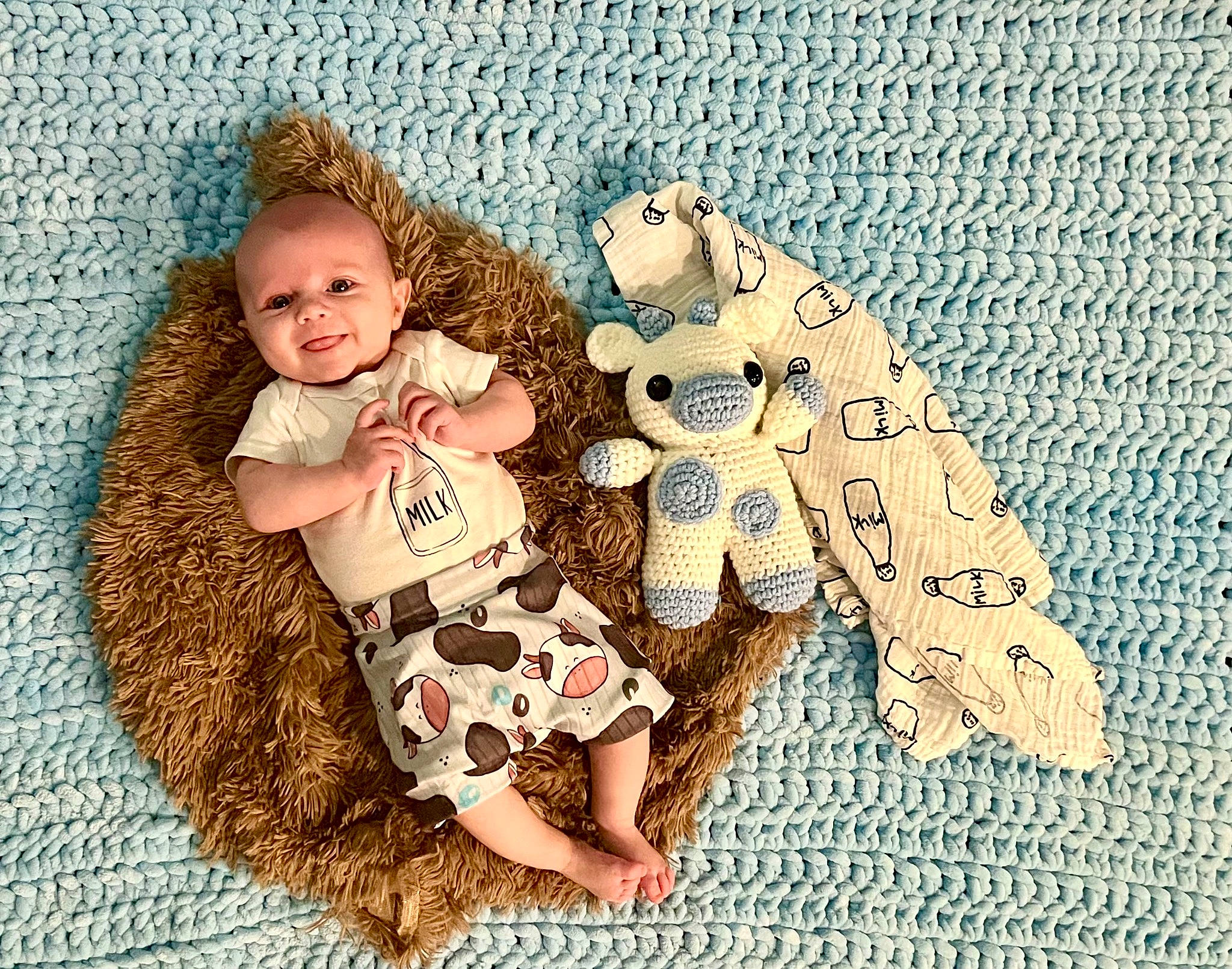 Noah is registered to the contest to win money with this photo: adaptation, art, baby, baby_toddler_clothing, child, facial_expression, fawn, font, grass, happy, interaction, linens, pattern, people_in_nature, person, stuffed_toy, teddy_bear, textile, toddler, toy