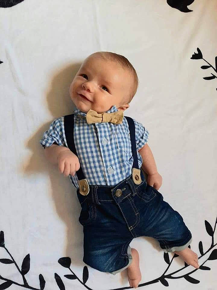 Cason is registered to the contest to win money with this photo: baby, baby_toddler_clothing, cheek, child, design, jeans, pattern, person, photography, sitting, sleeve, suspenders, toddler