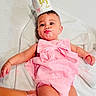 Indira joined the competition — help win amazing prizes! baby, child, pink_dress, bow, crown, face_paint, messy, lying_down, blanket, infant, cute, celebration, half_birthday, hand, skin, person, adorable, young, happy, indoor